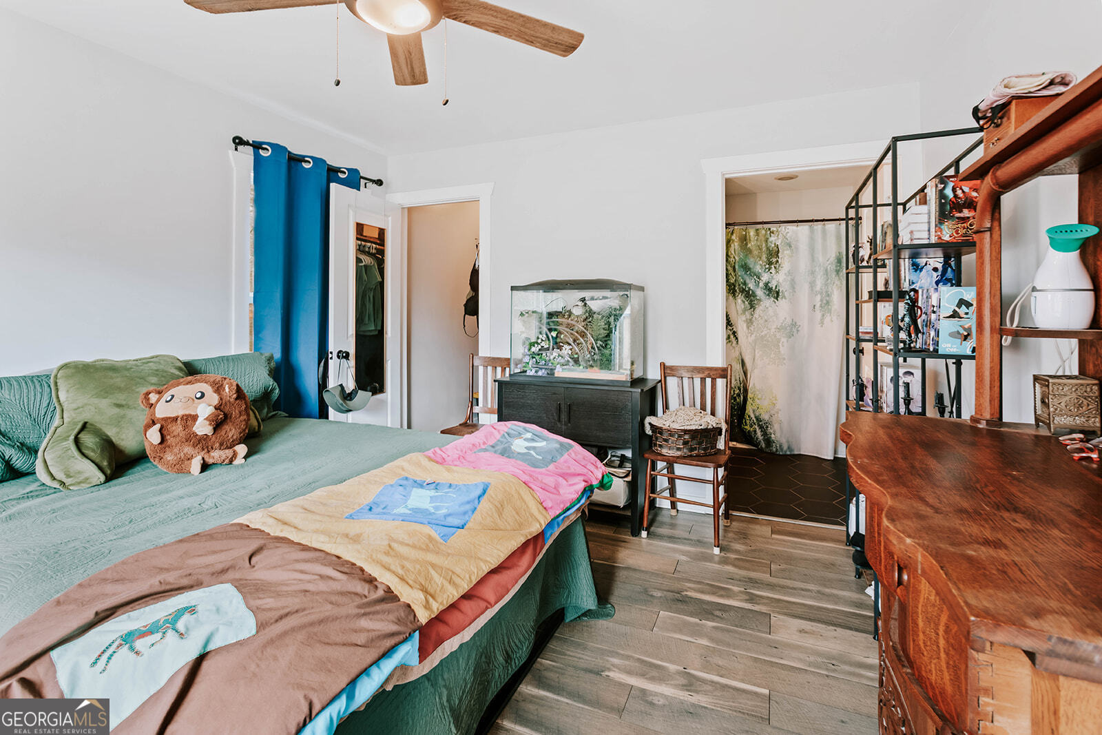 2820 Davis Academy Road Rutledge, GA 30663 - Photo 60 of 65 a bedroom with bed and a chandelier