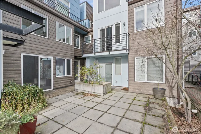 a front view of a house with chairs