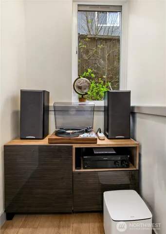 a living room with a fireplace and a window