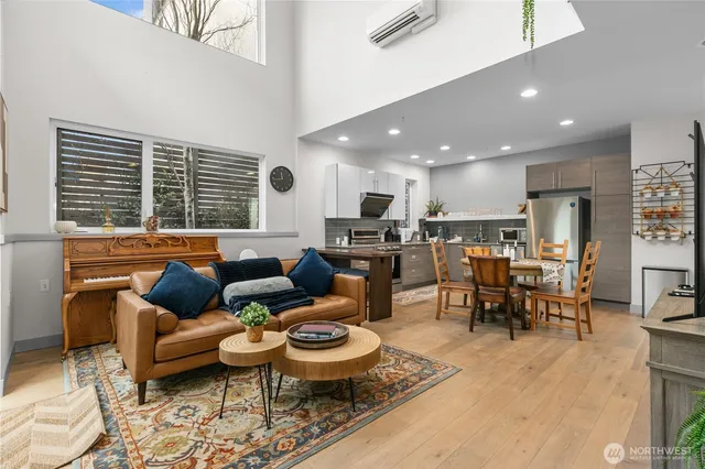 a living room with furniture kitchen and a table