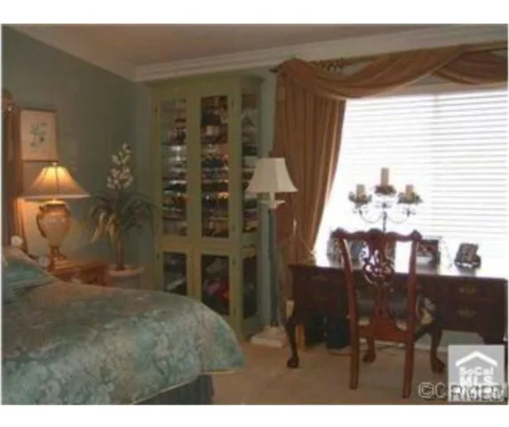 a view of a livingroom with furniture and window