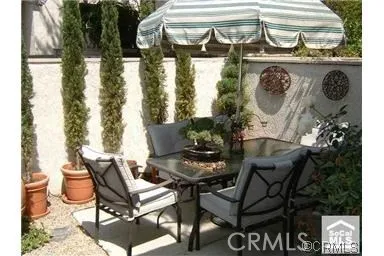 a view of a chairs and table in a patio