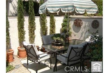 9 Evening Breeze Irvine, CA 92603 - Photo 12 of 30 a view of a chairs and table in a patio