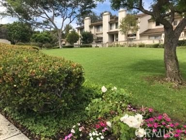 9 Evening Breeze Irvine, CA 92603 - Photo 20 of 30 a view of a house with a big yard and large trees
