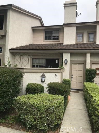9 Evening Breeze Irvine, CA 92603 - Photo 2 of 30 a front view of a house with garden