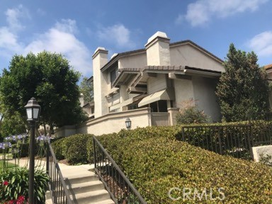9 Evening Breeze Irvine, CA 92603 - Photo 3 of 30 a view of a house with a yard