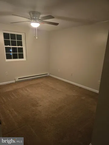 a view of empty room with windows