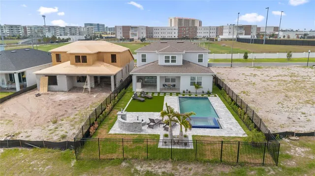 a kitchen with a stove a fridge and a sink