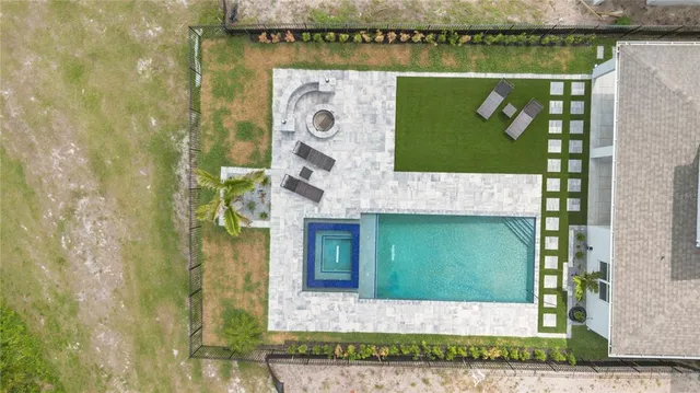 a view of a swimming pool with a lounge chair