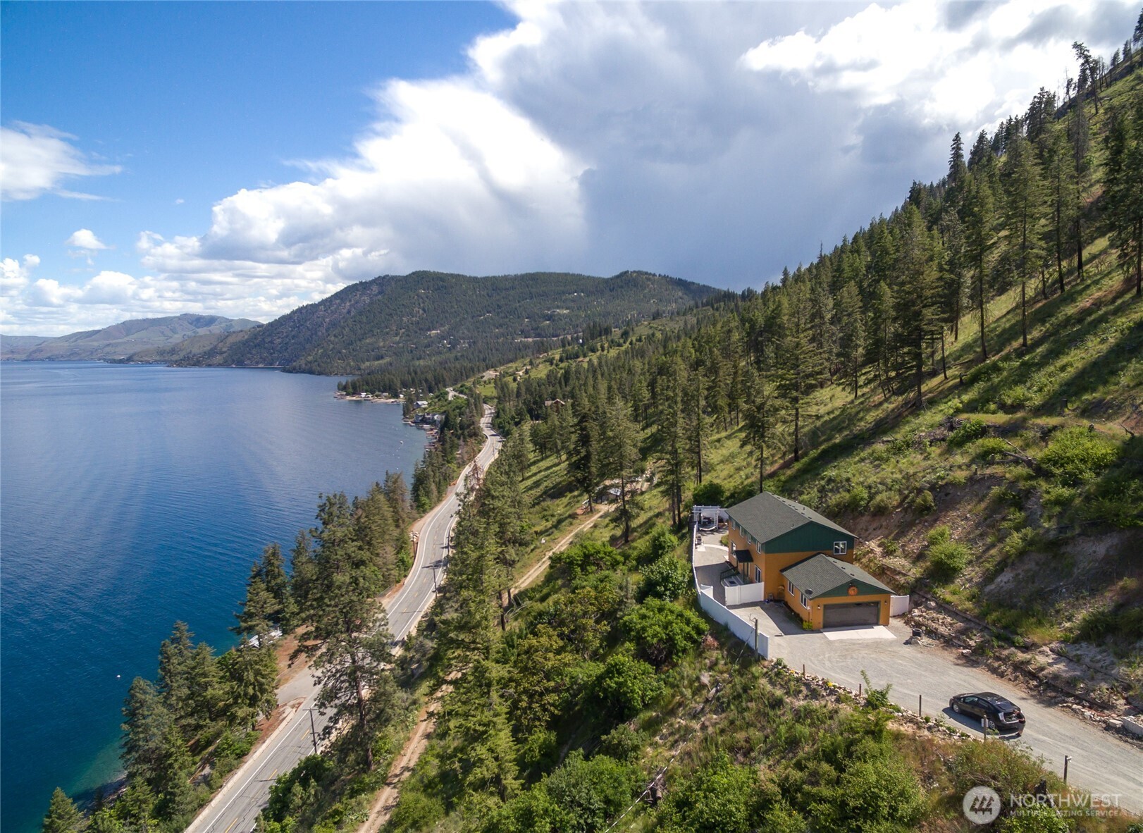 165 Granite Falls Road Chelan, WA 98816 - Photo 1 of 27 an aerial view of house with yard and mountain view in back