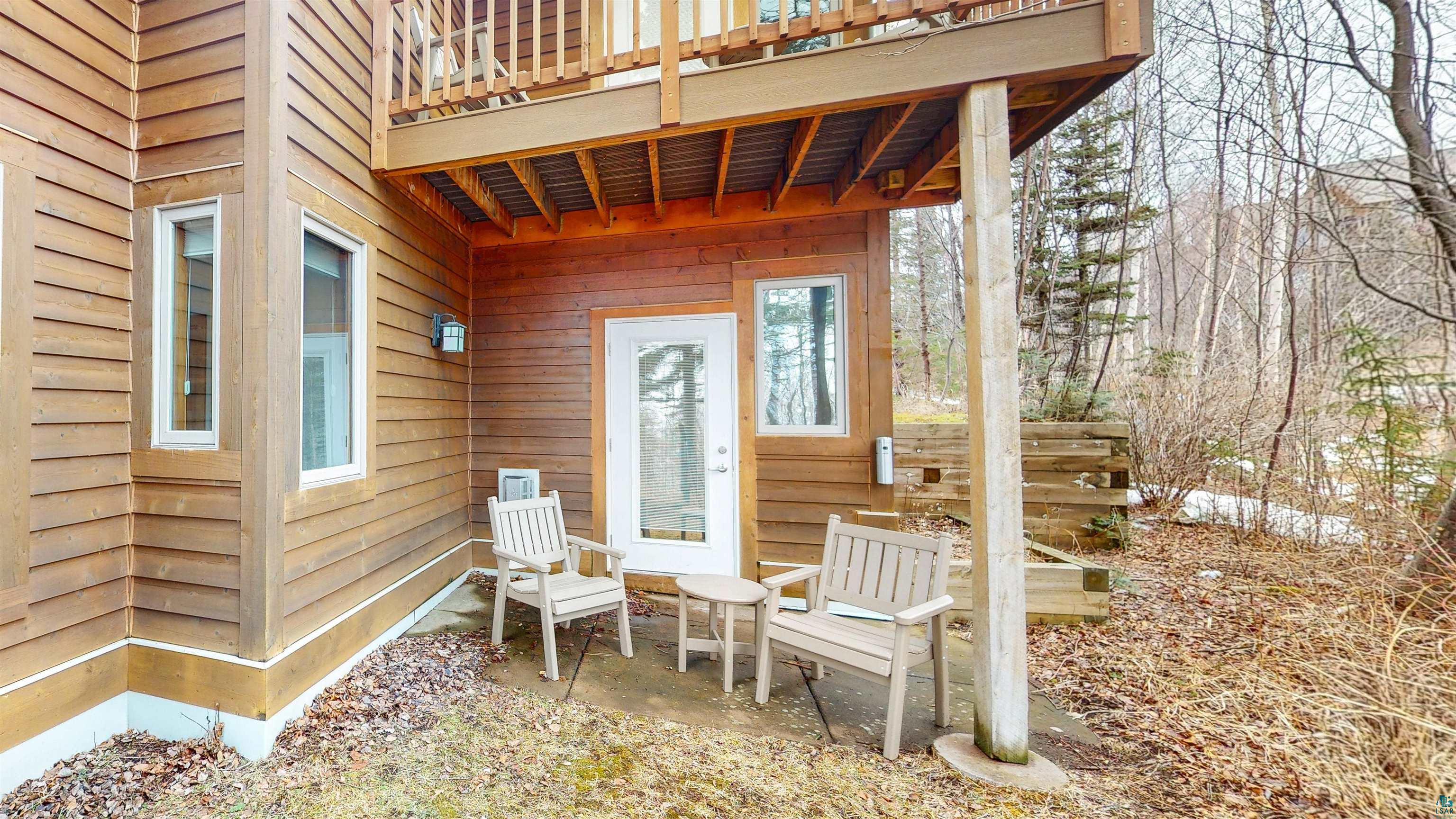 504-506 Poplar River Road, Unit 505 Lutsen, MN 55612 - Photo 22 of 39 Exterior wood-siding with white-framed windows and a glass-paneled door