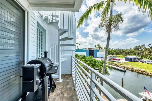 a view of a balcony with chairs and a table