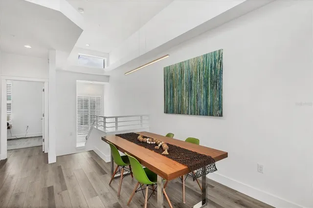 a living room with a table and chairs