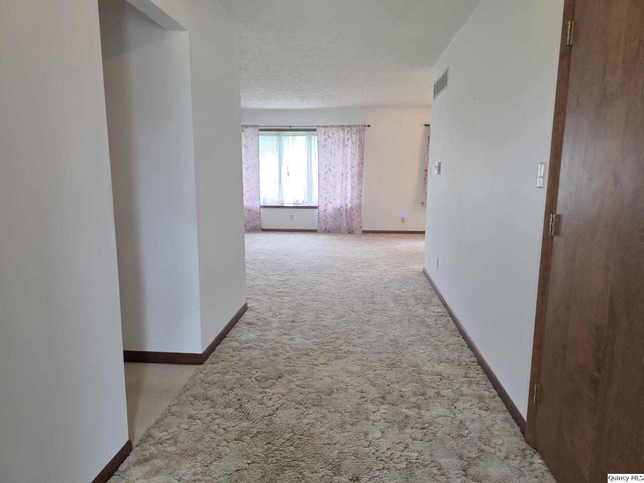 502 North Chestnut Street Versailles, IL 62378 - Photo 12 of 32 an empty room with windows