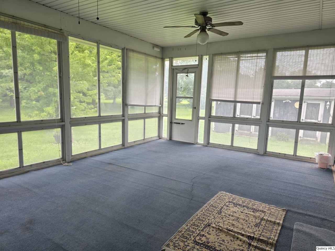 502 North Chestnut Street Versailles, IL 62378 - Photo 19 of 32 a view of an empty room with a window