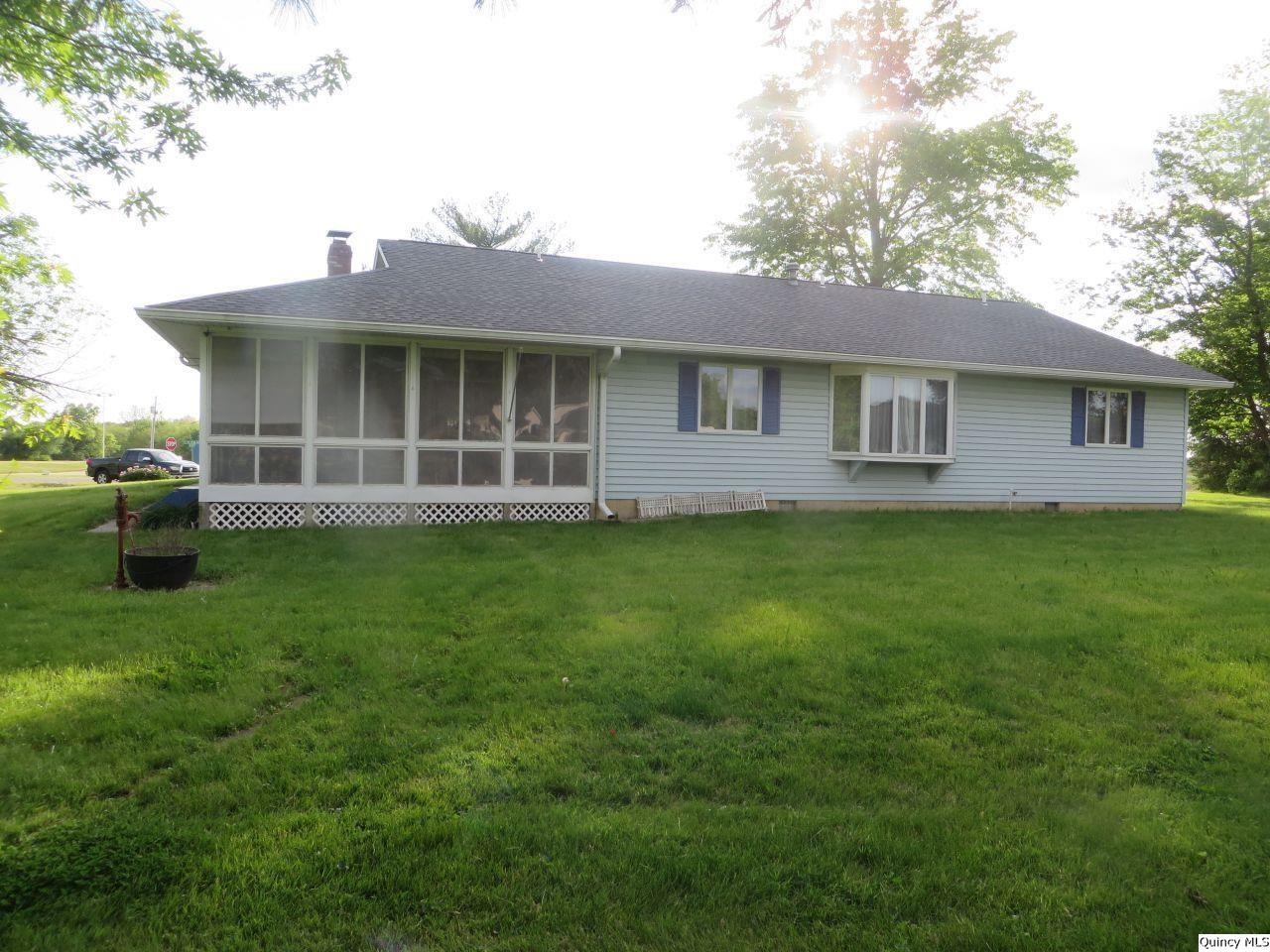 502 North Chestnut Street Versailles, IL 62378 - Photo 2 of 32 a view of a house with a yard