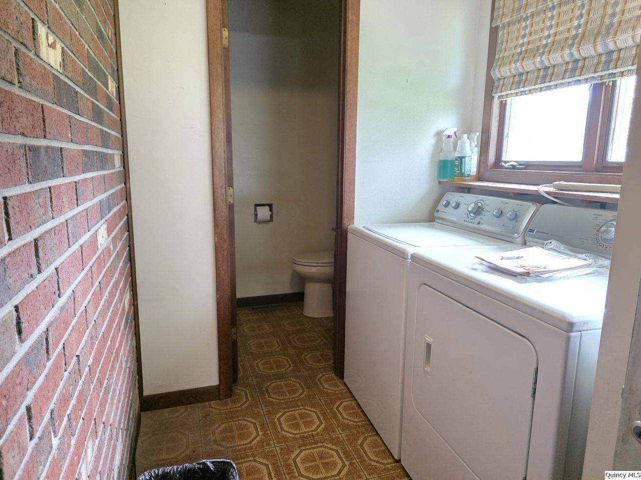 502 North Chestnut Street Versailles, IL 62378 - Photo 21 of 32 a bathroom with a sink toilet and window