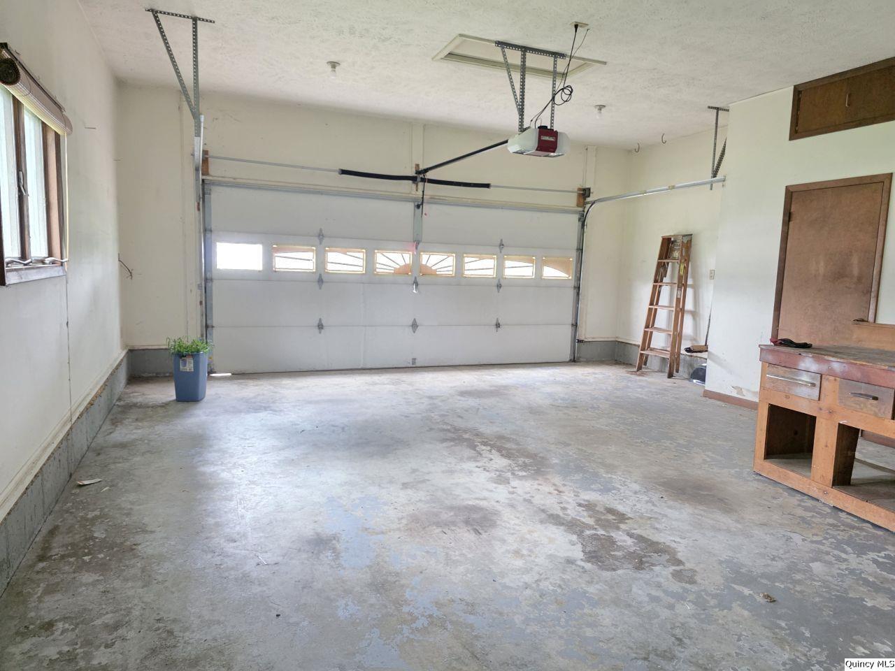 502 North Chestnut Street Versailles, IL 62378 - Photo 23 of 32 a view of a garage with furniture