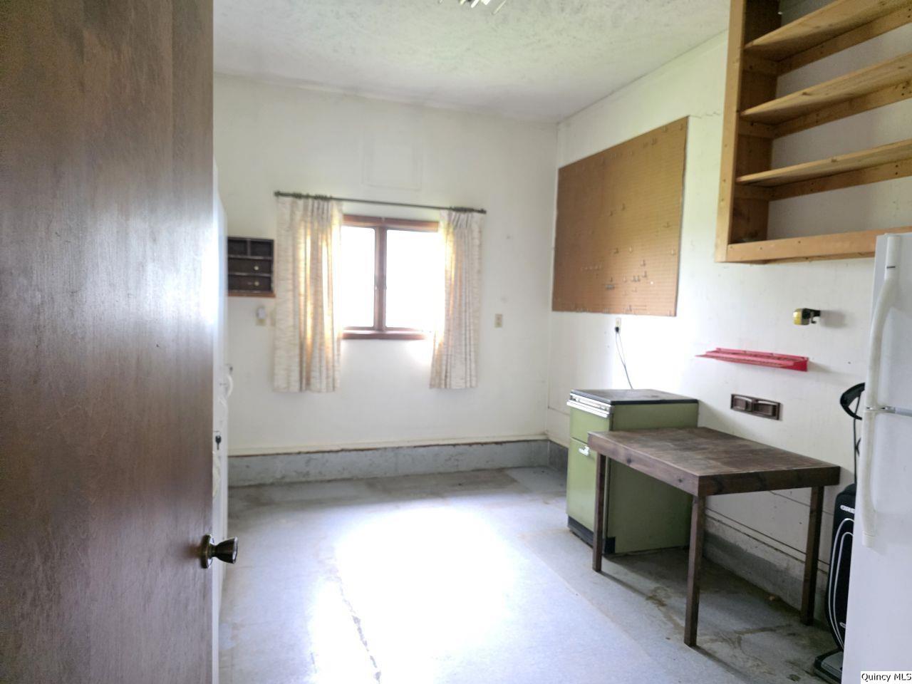 502 North Chestnut Street Versailles, IL 62378 - Photo 24 of 32 a workspace with furniture and window