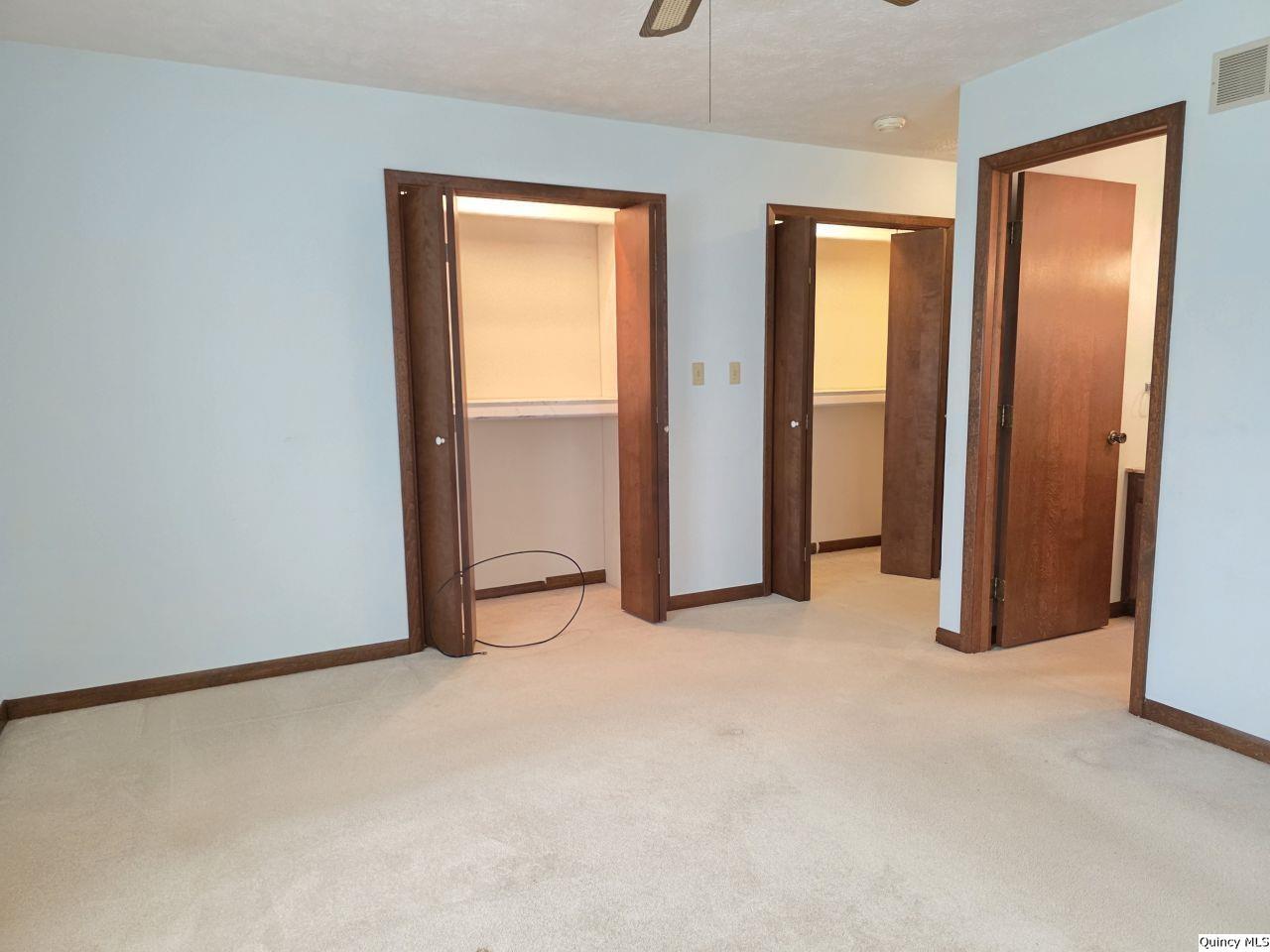 502 North Chestnut Street Versailles, IL 62378 - Photo 32 of 32 an empty room with windows and closet