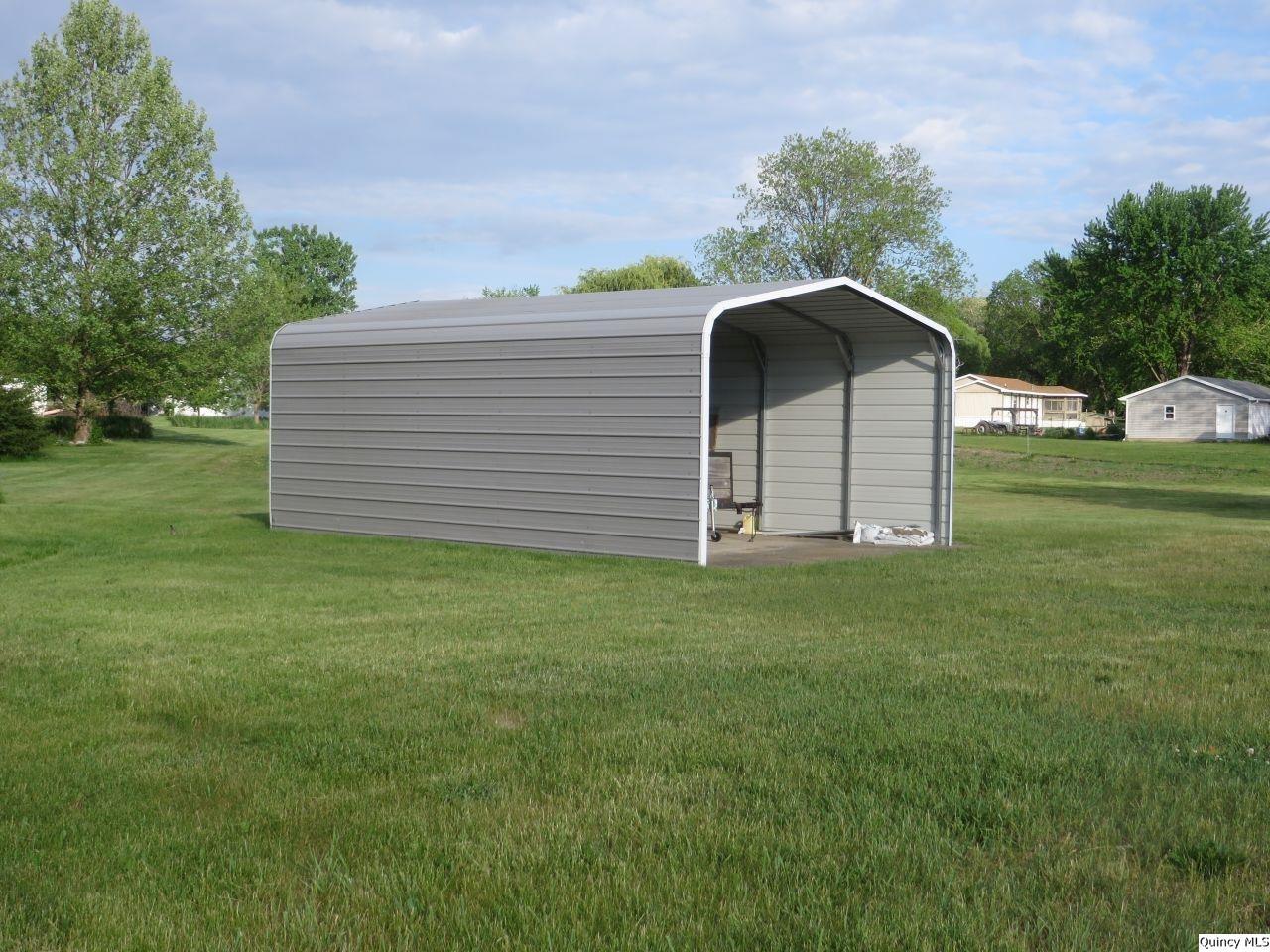502 North Chestnut Street Versailles, IL 62378 - Photo 8 of 32 a view of a back yard of the house