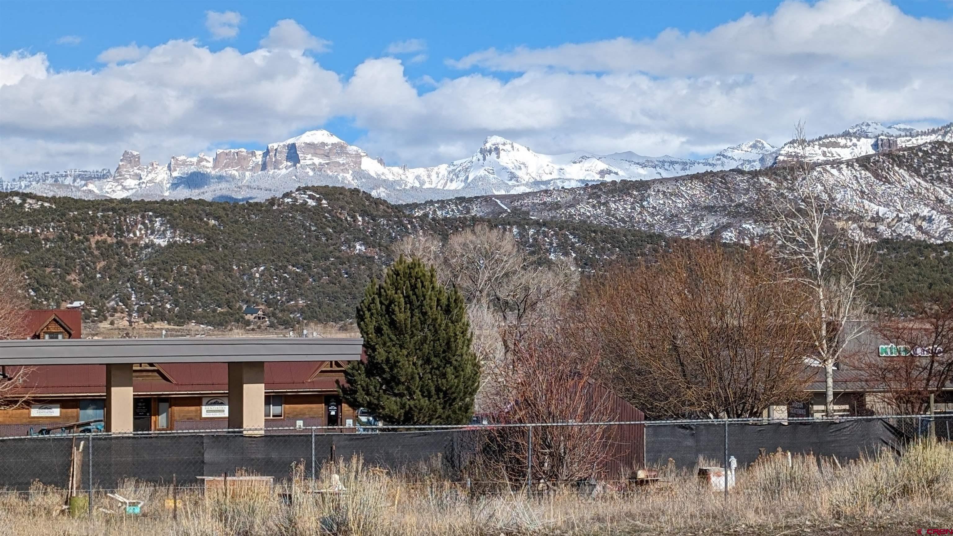 Tbd Tbd Railroad/hyde Street Ridgway, CO 81432 - Photo 3 of 4 a view of a lake with a house in the background