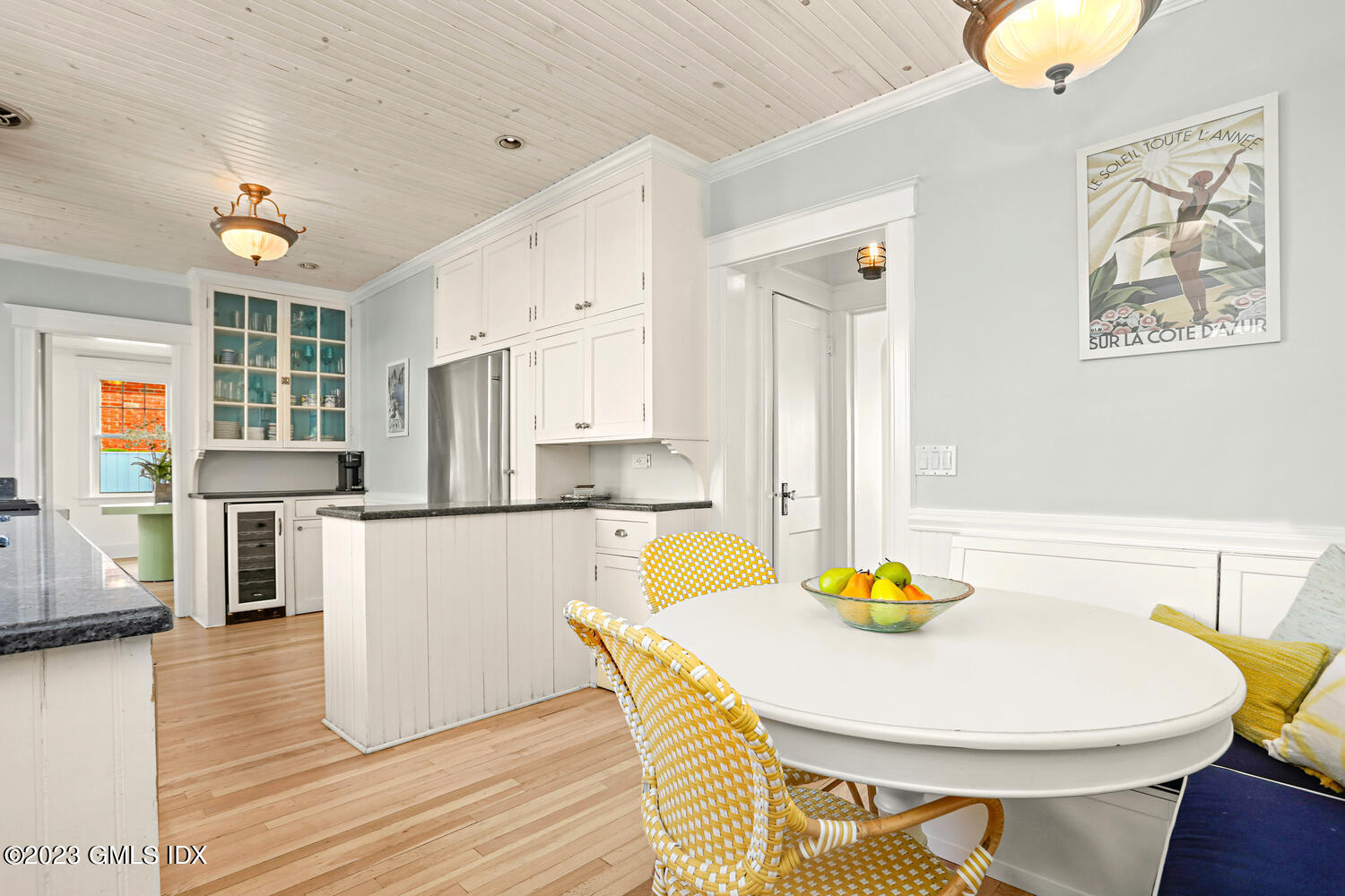 46 Ocean Drive North Stamford, CT 06902 - Photo 13 of 34 a kitchen with stainless steel appliances wooden floor dining table and chairs