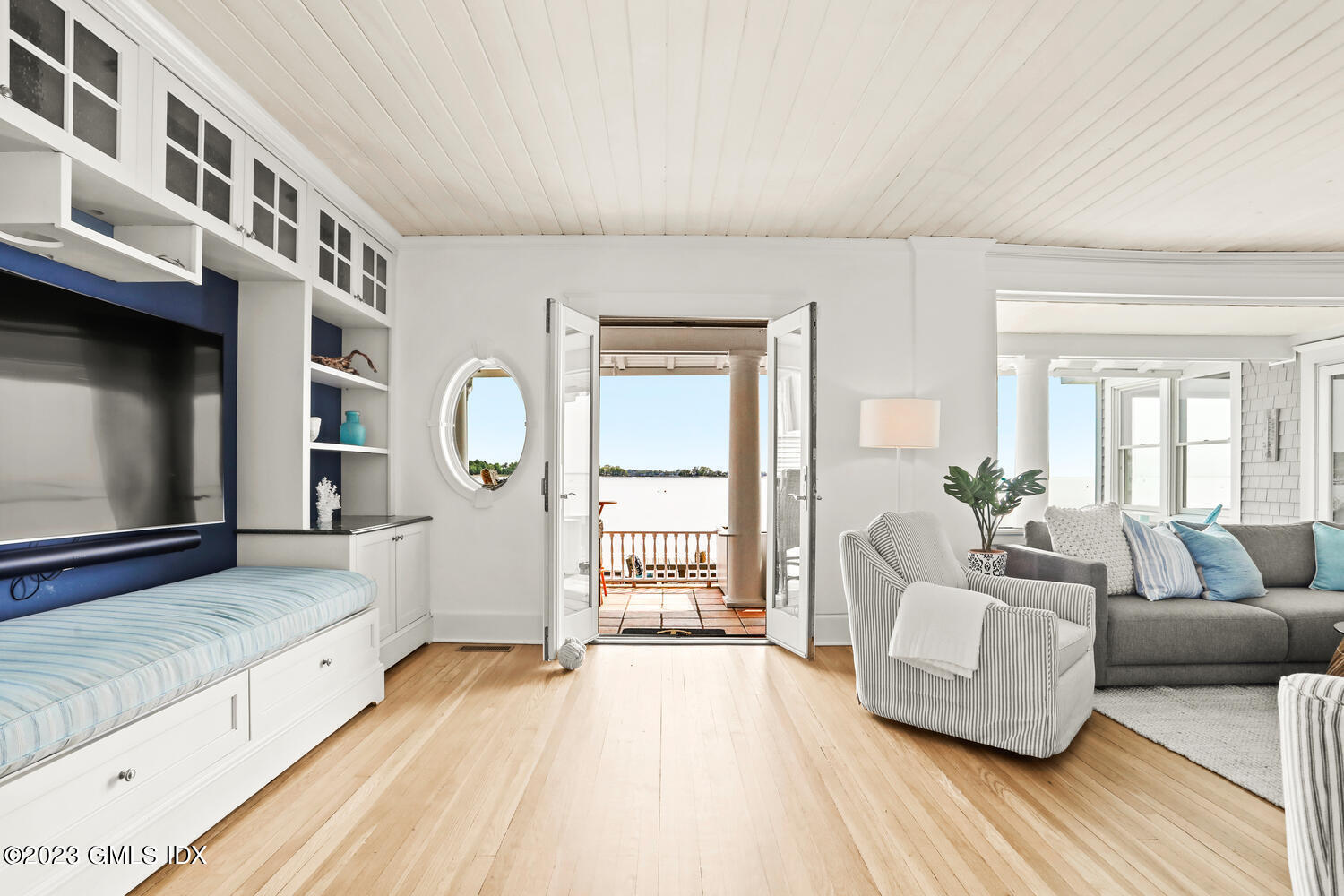 46 Ocean Drive North Stamford, CT 06902 - Photo 14 of 34 a living room with furniture and a fireplace