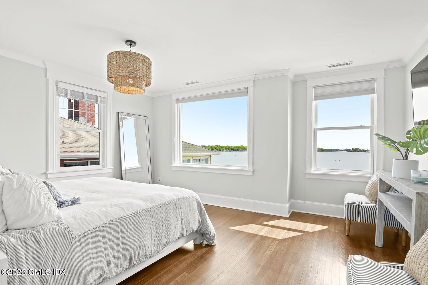 46 Ocean Drive North Stamford, CT 06902 - Photo 18 of 34 a bedroom with a bed and wooden floor