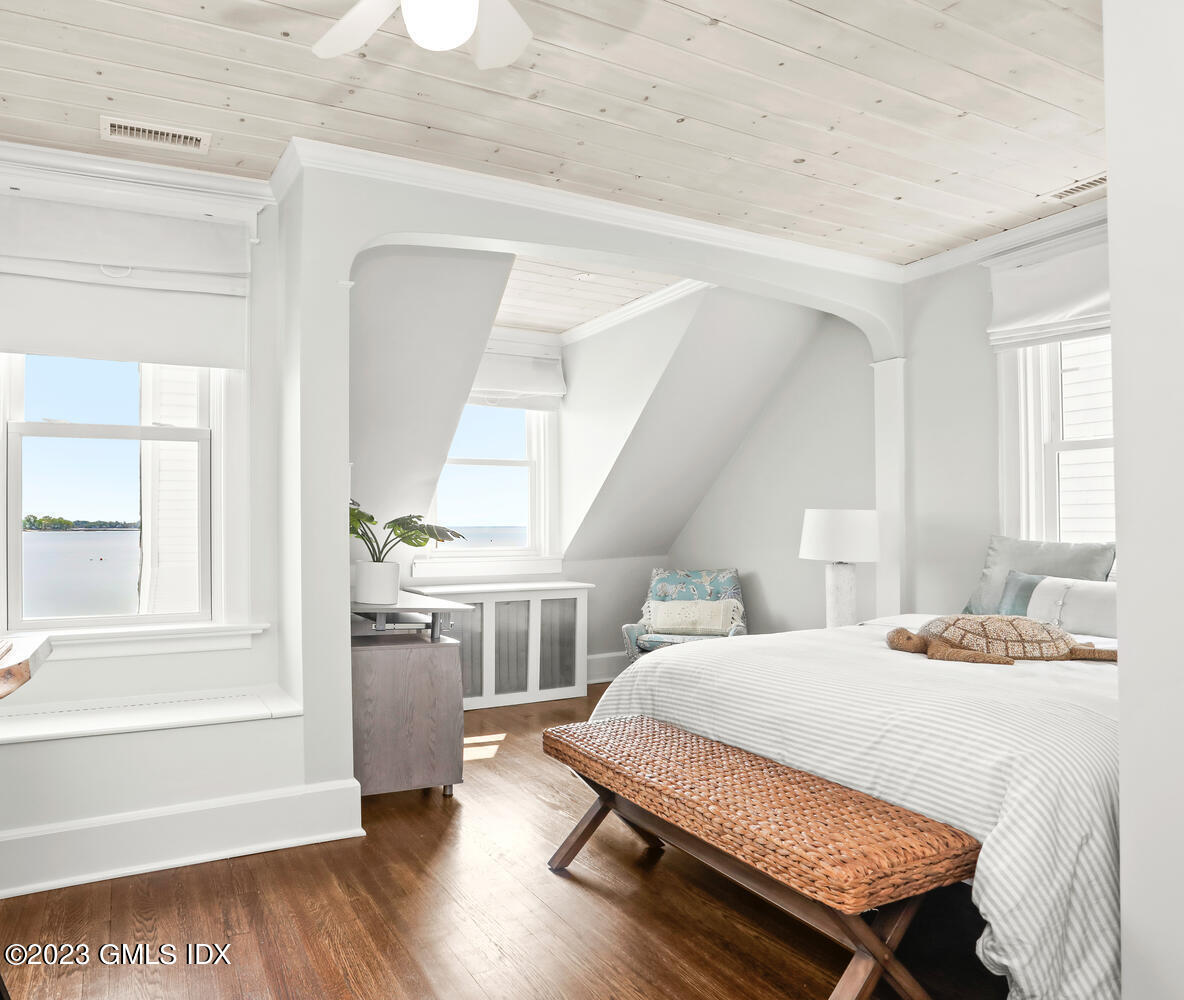 46 Ocean Drive North Stamford, CT 06902 - Photo 20 of 34 a bedroom with a bed and wooden floor