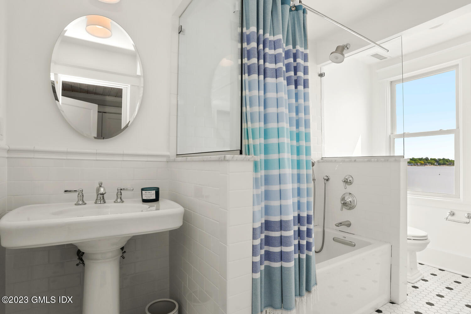 46 Ocean Drive North Stamford, CT 06902 - Photo 21 of 34 a bathroom with a sink a toilet and shower