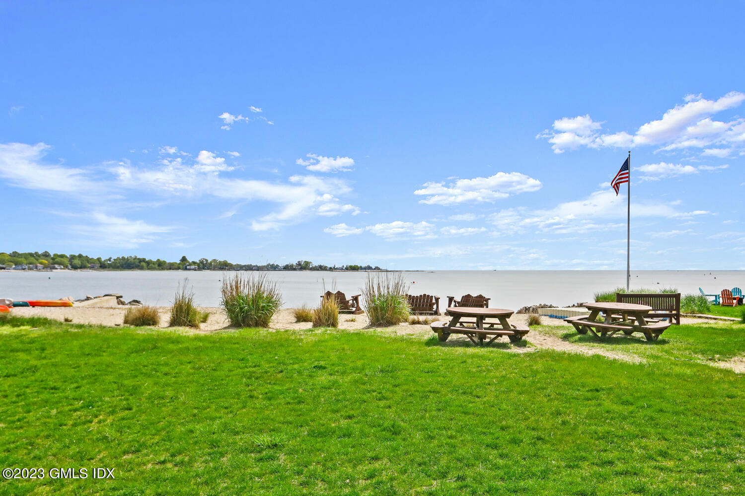 46 Ocean Drive North Stamford, CT 06902 - Photo 33 of 34 a view of a lake with lawn chairs