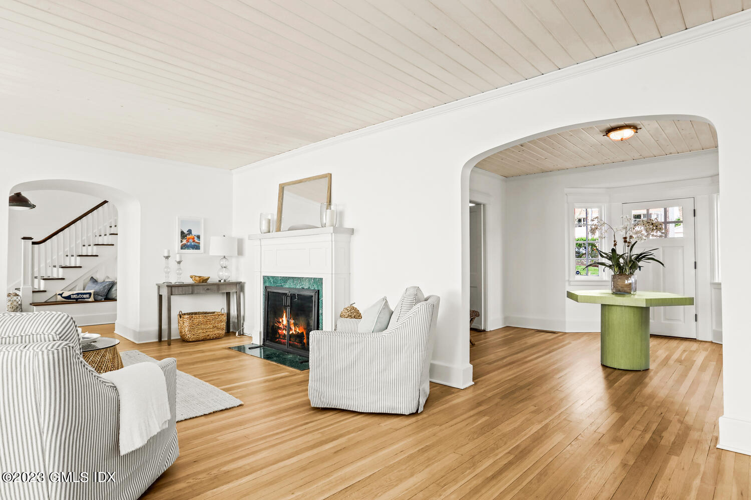 46 Ocean Drive North Stamford, CT 06902 - Photo 8 of 34 a living room with furniture and a fireplace