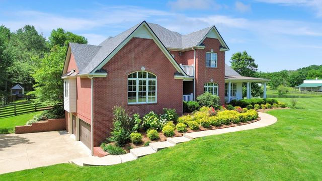 a view of a swimming pool with a lounge chairs