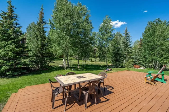 a patio with table and chairs