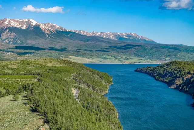 a bed sitting in a room next to a window