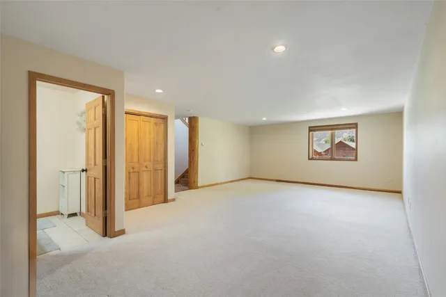 a bathroom with a sink mirror vanity and toilet