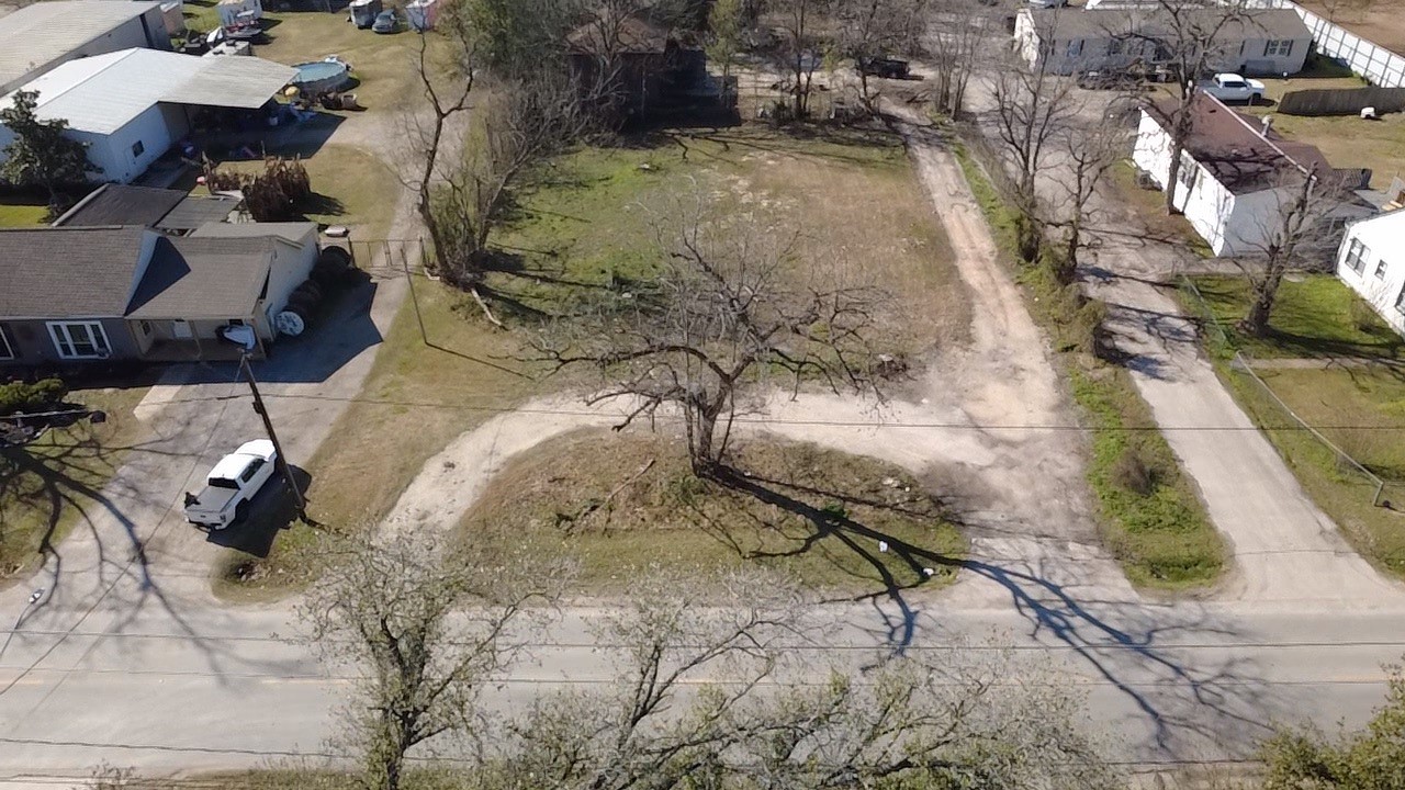 11921 Gloger Street Houston, TX 77039 - Photo 4 of 7 an aerial view of a house with a yard