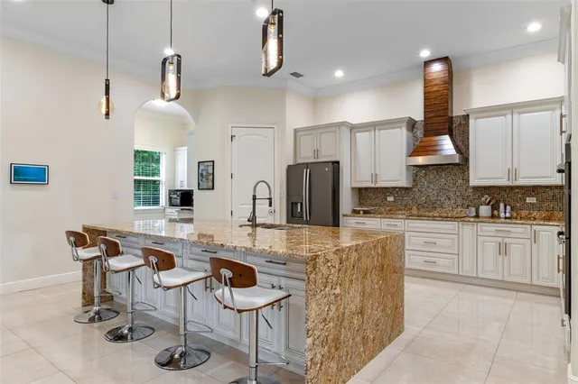 a kitchen with stainless steel appliances granite countertop a sink and cabinets