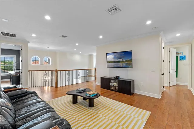 a workspace with wooden floor and a ceiling fan