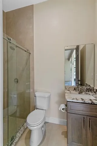 an aerial view of a house with outdoor space swimming pool and mountains