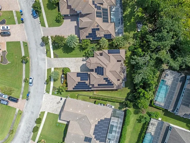 an aerial view of residential houses with outdoor space