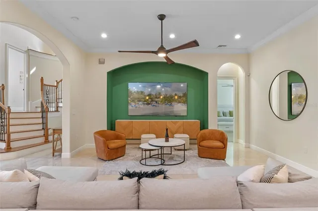 a living room with furniture a rug and a window