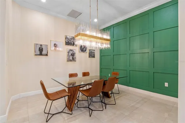 a view of a room with lots of furniture and windows