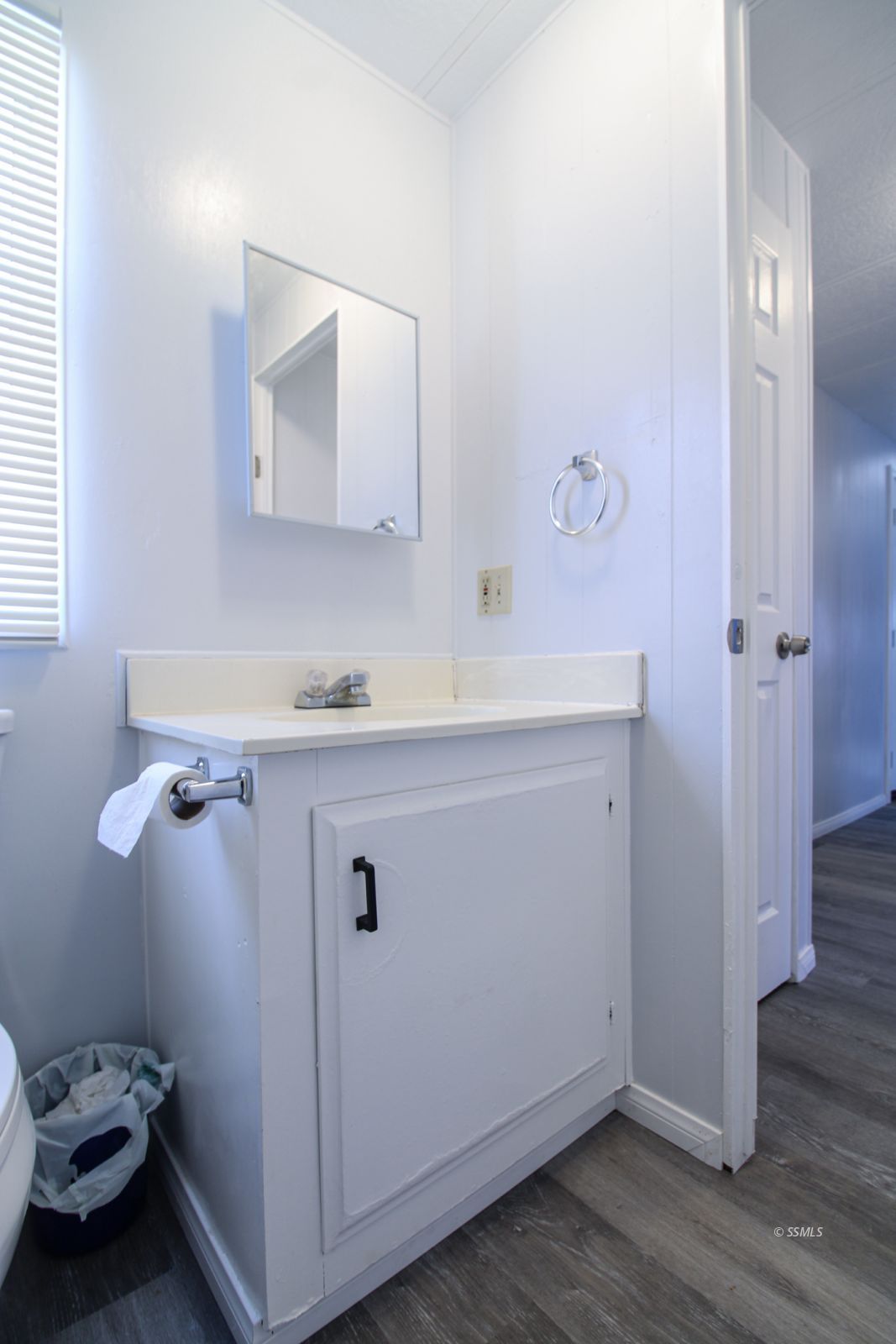 1441 West Iowa Avenue Ridgecrest, CA 93555 - Photo 20 of 27 a bathroom with a sink toilet and mirror