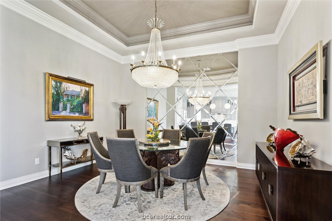 5202 Bourrone Court Bryan, TX 77802 - Photo 17 of 43 The dining room impresses with a beveled mirrored wall and Allegri chandelier