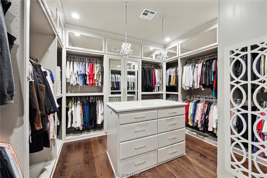5202 Bourrone Court Bryan, TX 77802 - Photo 28 of 43 An extension of the Primary Walk in closet with chandeliers!