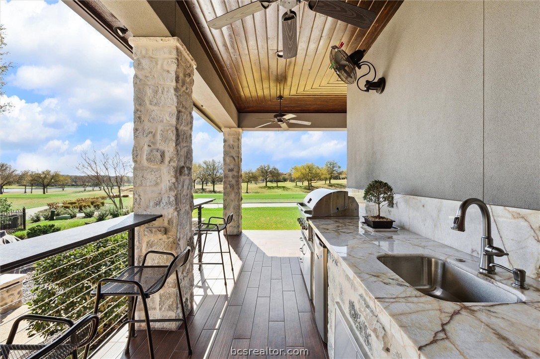 5202 Bourrone Court Bryan, TX 77802 - Photo 37 of 43 Out door kitchen with sink and view of hole #9.