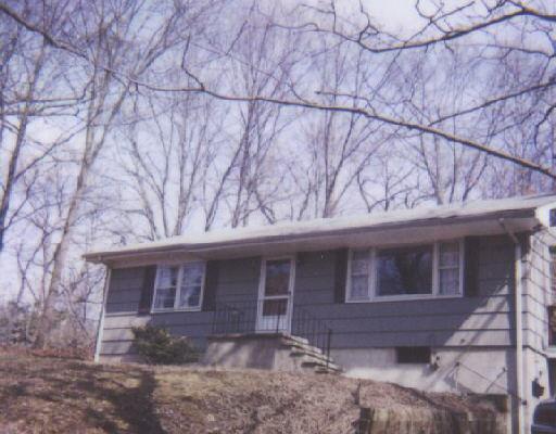 25 Rockmeadow Road Norwalk, CT 06850 - Photo 1 of 1 a front view of a house with garden