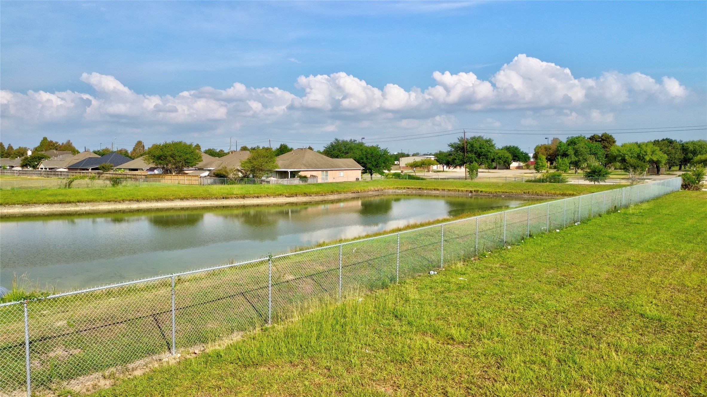 4242 Keith Road Pasadena, TX 77505 - Photo 12 of 15 Keith St. View of gated detention pond